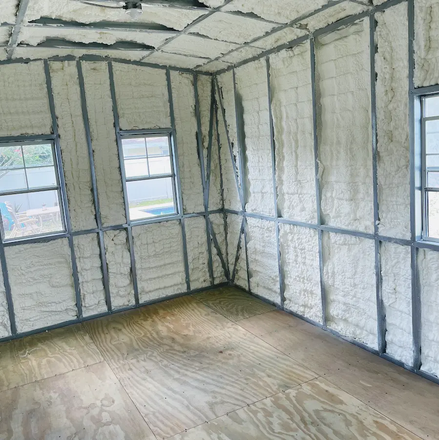 Closed-cell spray foam insulation applied to wall cavities in a residential project in Live Oak